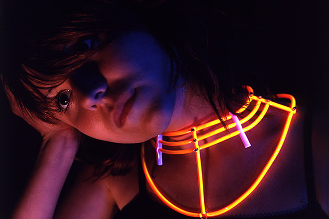Fluorescent orange collar glowing under black light